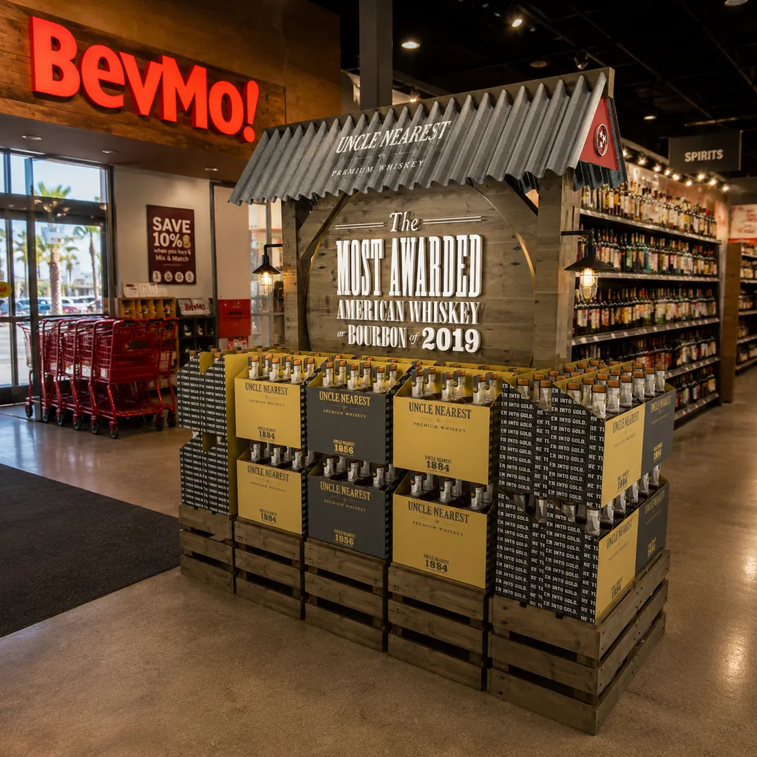 Uncle Nearest semi-permanent entryway display with wood crate base, corrugated metal roof, and lantern lighting